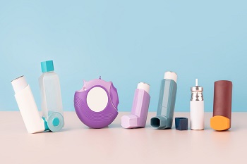 Set of asthma inhalers for asthma and COPD patients on table.